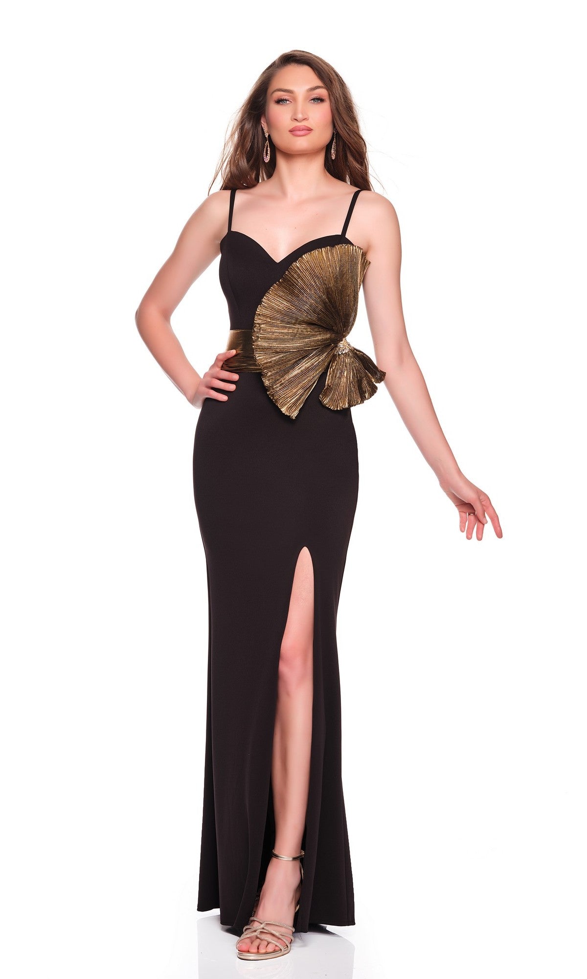 Woman wearing the Dave and Johnny 12666 long prom dress—sleeveless, black, with a high slit and gold applique at the waist—paired with hoop earrings and open-toe heels.